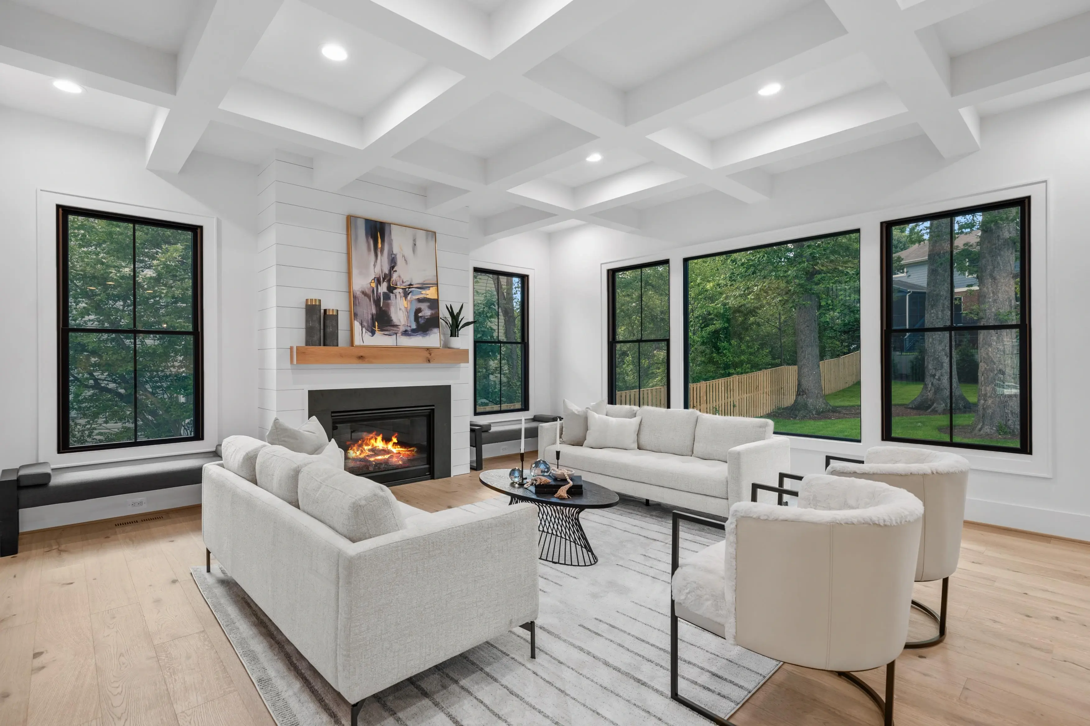 HDR real estate photography of a spacious living room with natural light, hardwood floors, and open floor plan in Northern Virginia