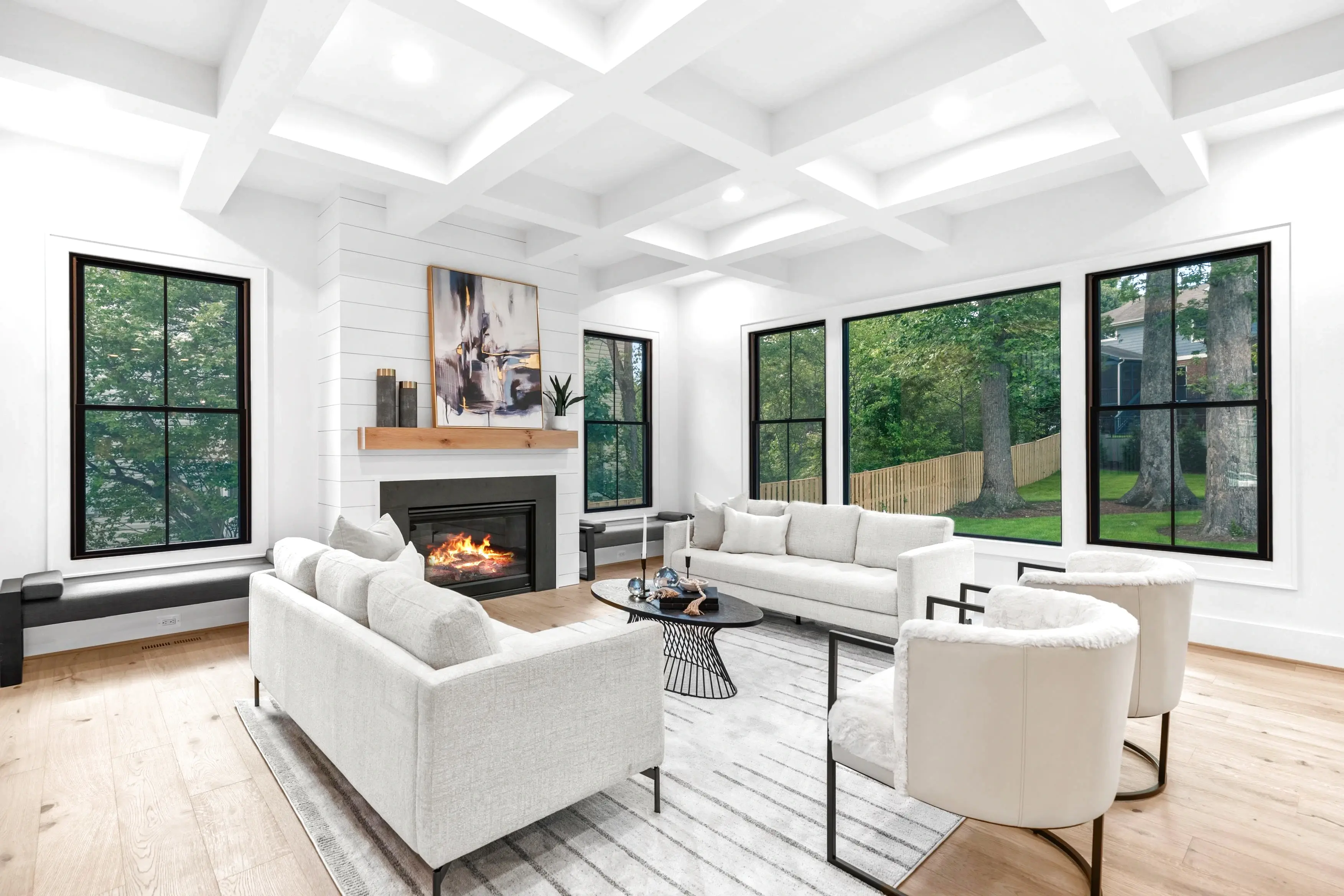 HDR real estate photography of a spacious living room with natural light, hardwood floors, and open floor plan in Northern Virginia