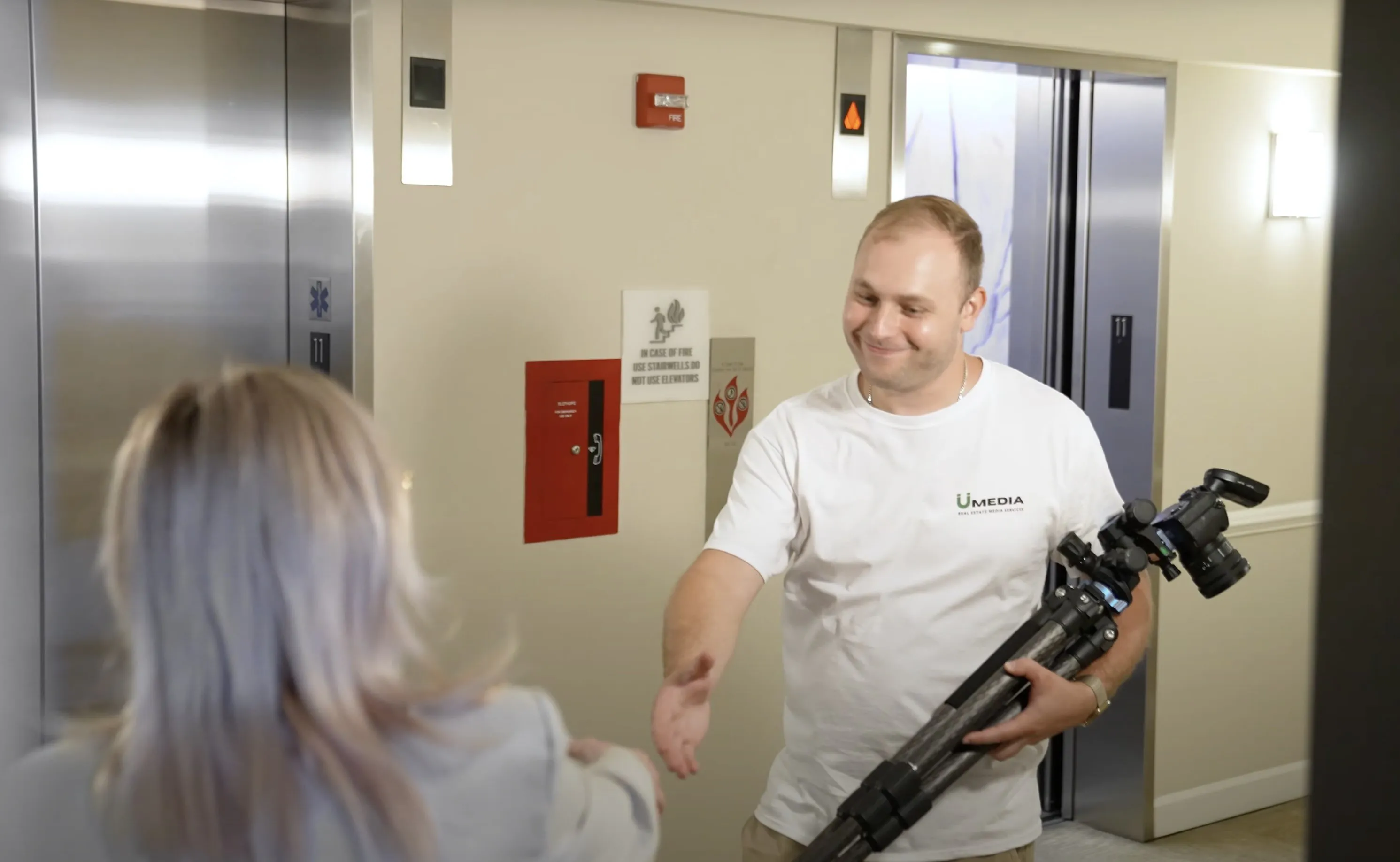 A professional videographer capturing a property walkthrough