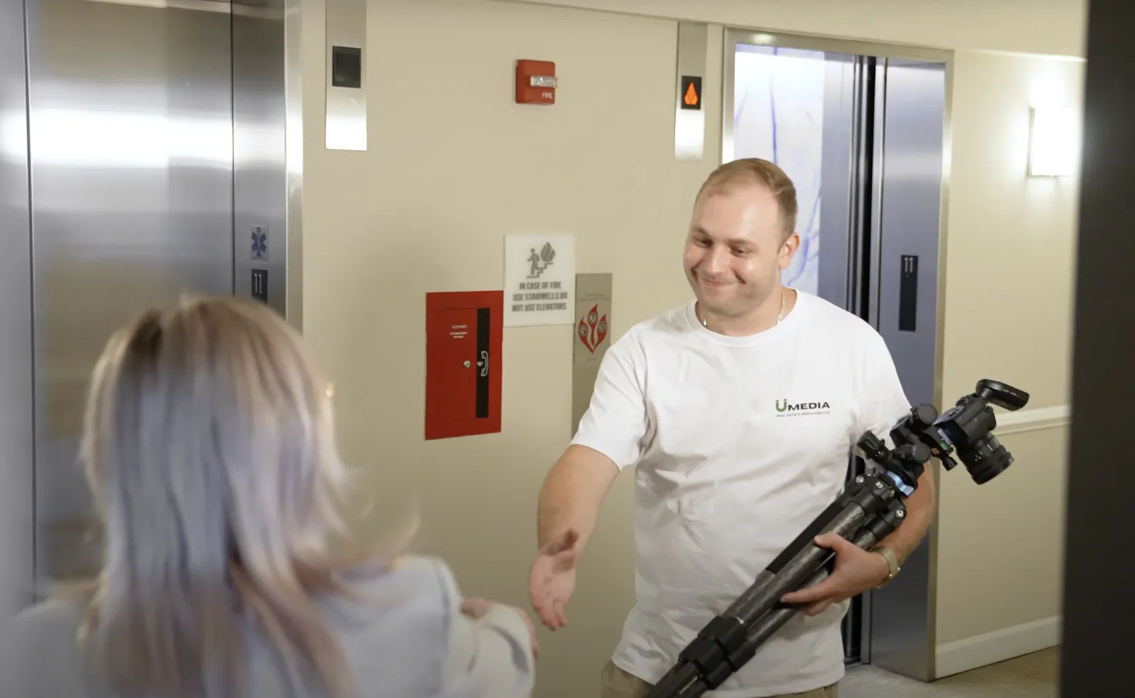 A professional videographer capturing a property walkthrough