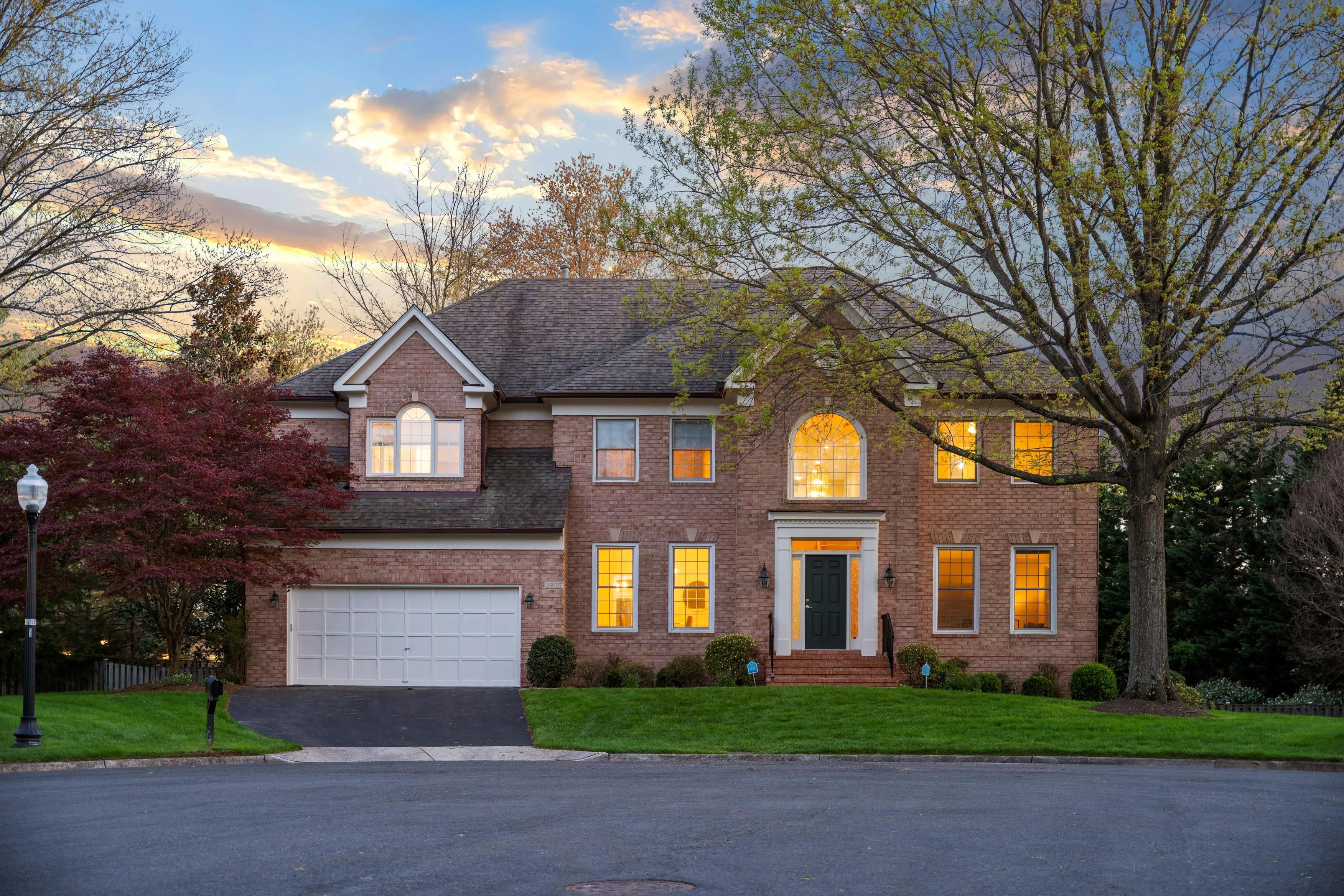 Oakton VA luxury brick colonial home exterior with landscaped grounds