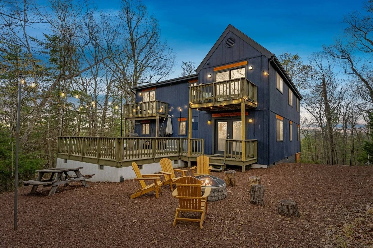 The same home at dusk with glowing windows and string lights — after virtual twilight conversion by Umedia