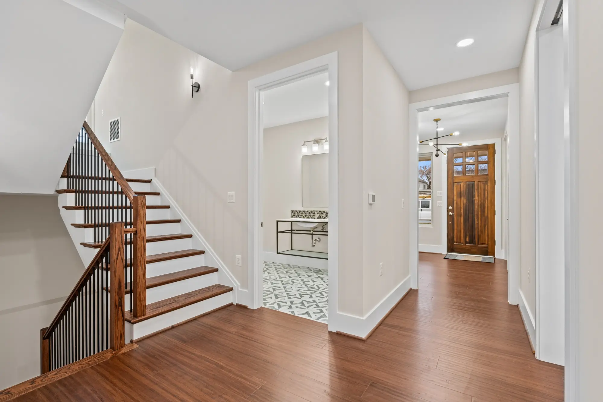 Photo of entryway and staircase of renovated house in Falls Church, VA by Umedia