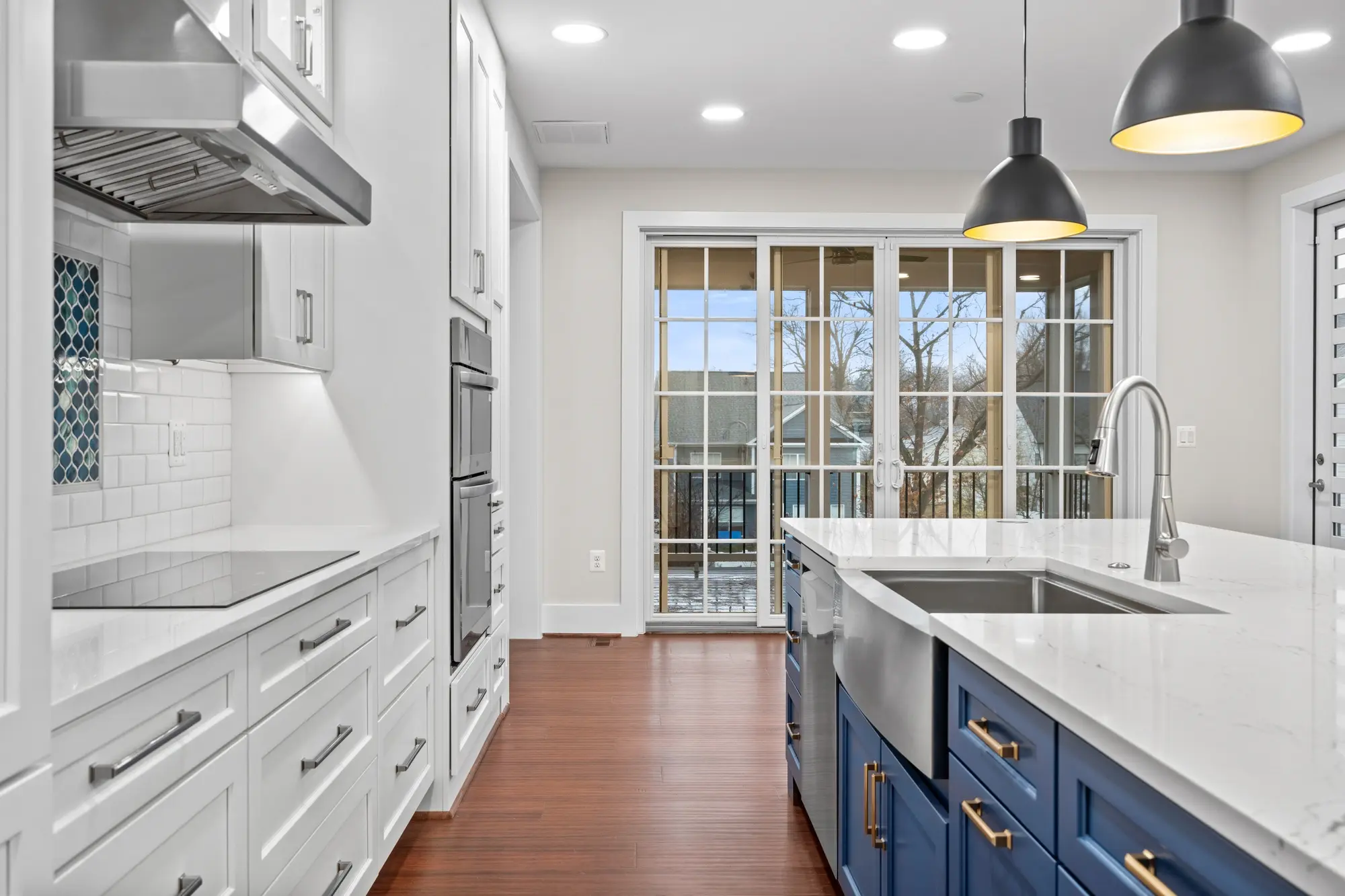 Gourmet kitchen with blue island, professional real estate photo by Umedia in Falls Church, VA