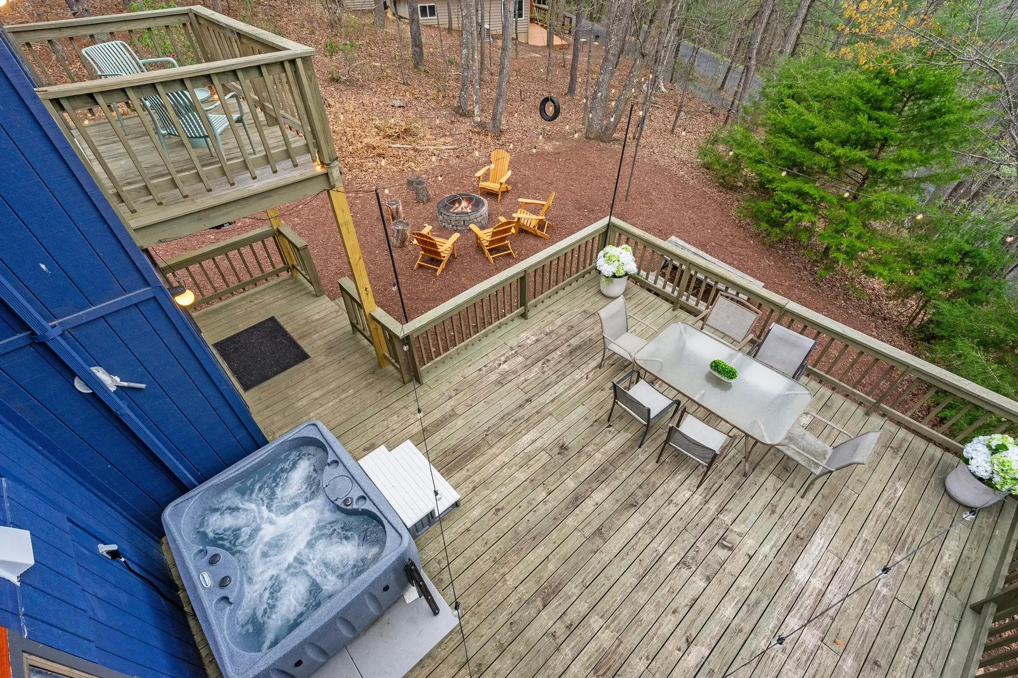 Balcony seating overlooking trees in Basye, VA vacation home