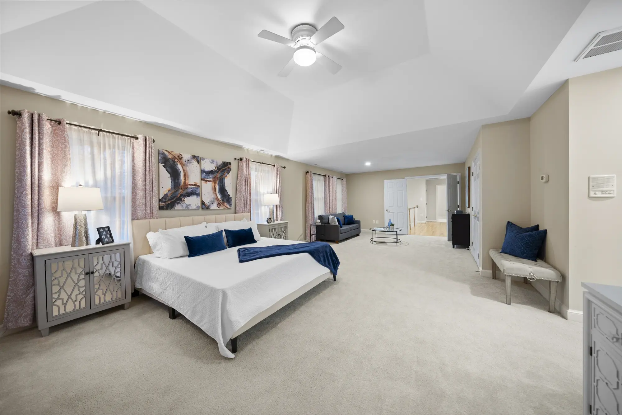 Spacious Oakton VA master bedroom with modern staging, neutral tones, and natural light — captured by Umedia real estate photography