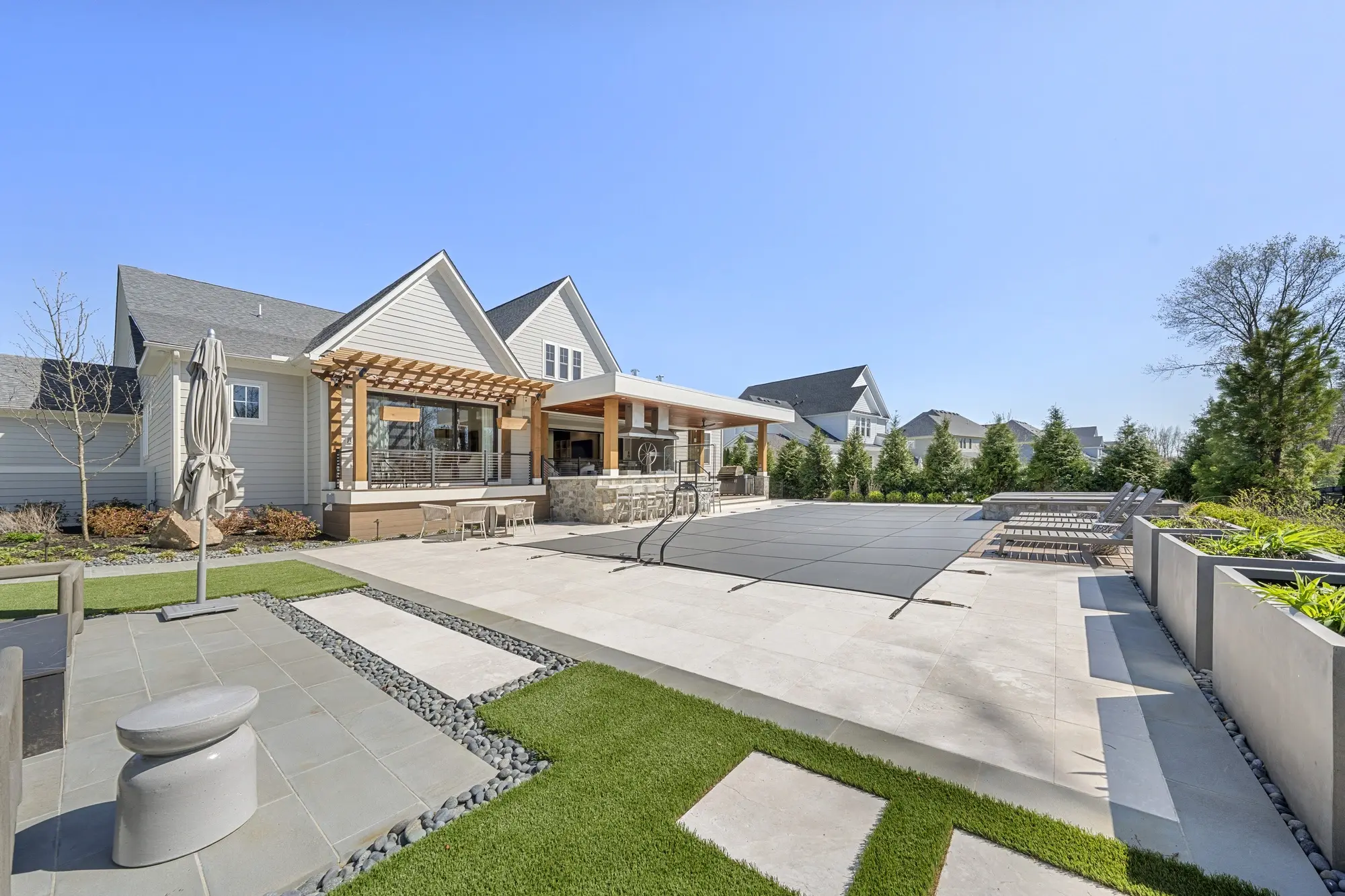 Elegant foyer with double-height ceiling and chandelier