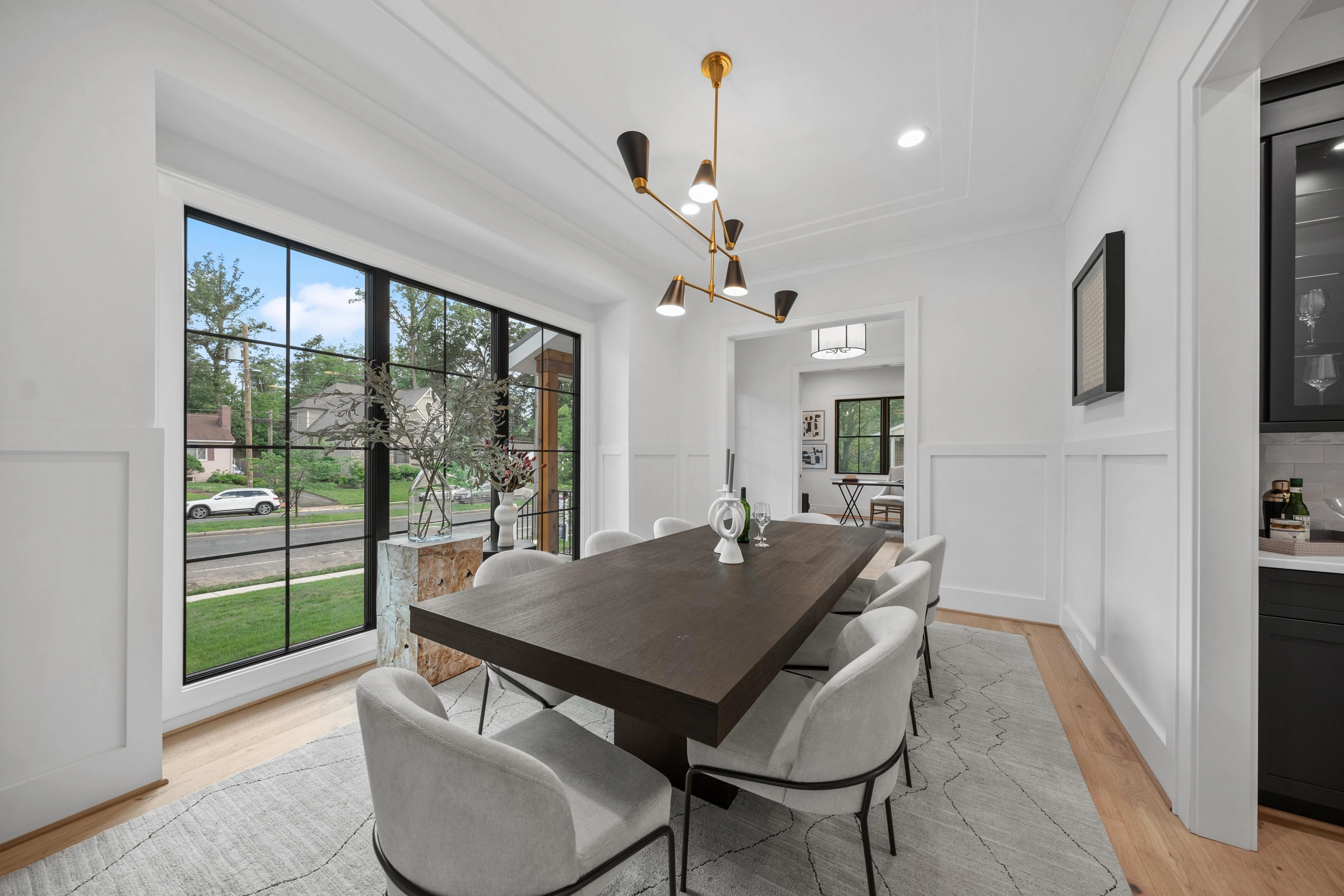 Formal dining room with custom woodwork and chandelier in Bethesda
