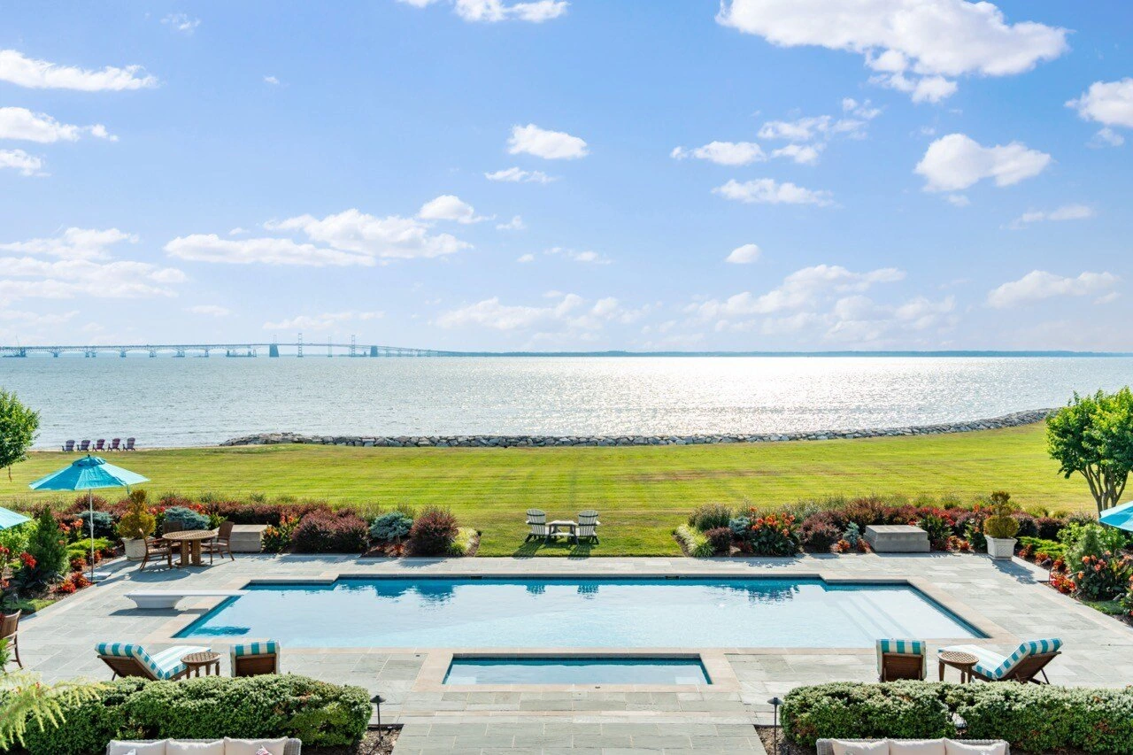 Infinity pool overlooking Chesapeake Bay with bridge in the distance