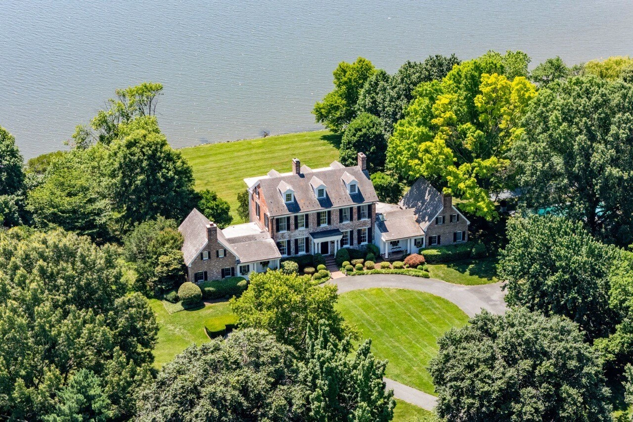Aerial panoramic drone shot of a waterfront property and its surroundings by Umedia