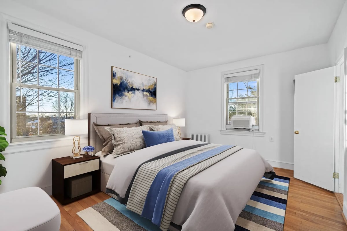 Staged bedroom with contemporary blue accents — after virtual staging