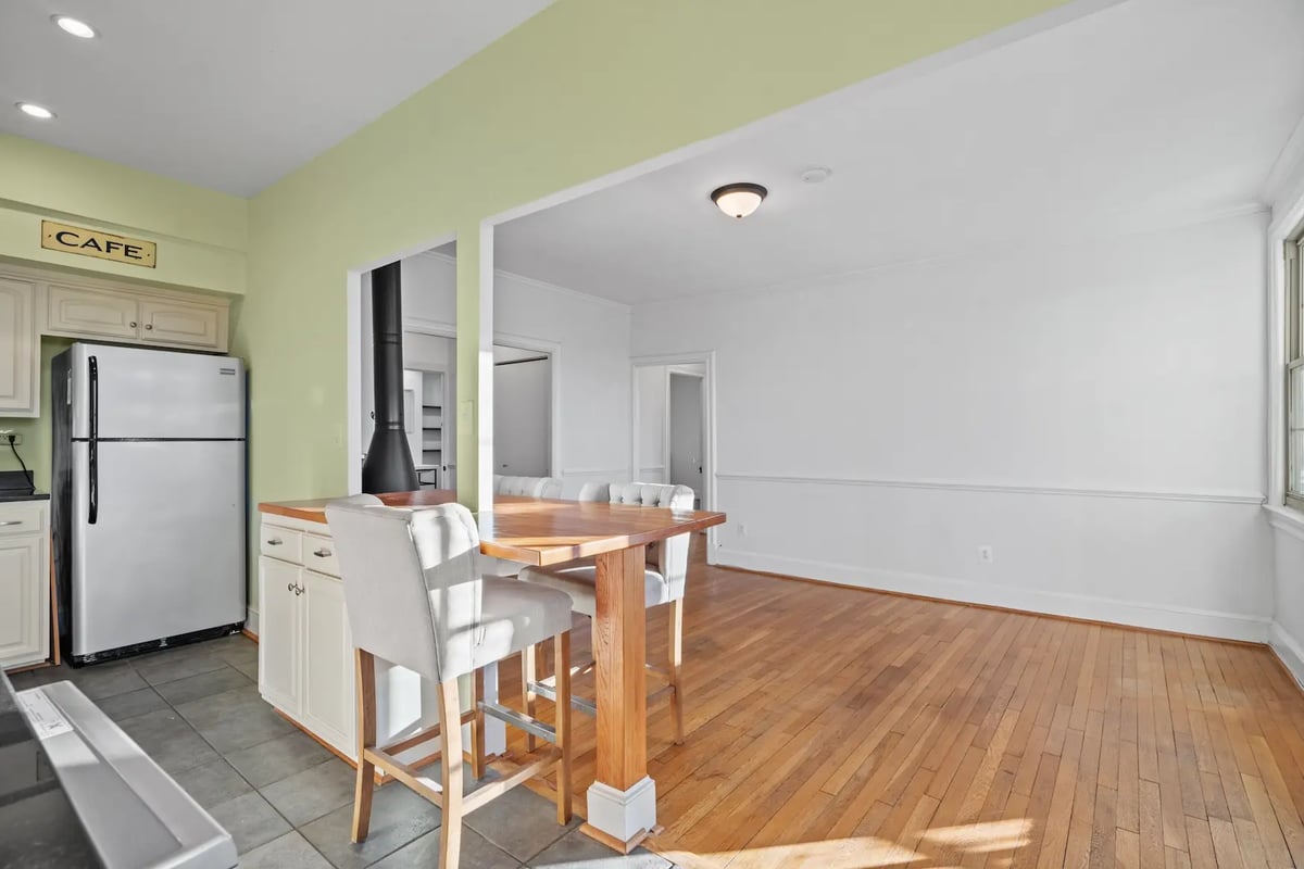 Kitchen with empty adjacent room — before virtual staging