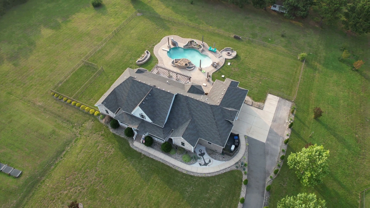 High-resolution aerial drone photography of estate with pool